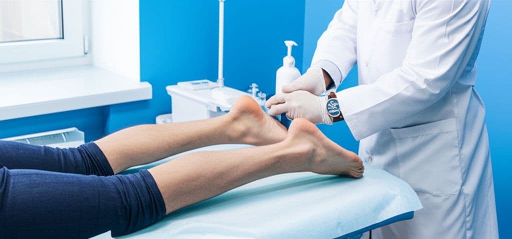 Runner holding their achilles tendon area during a run