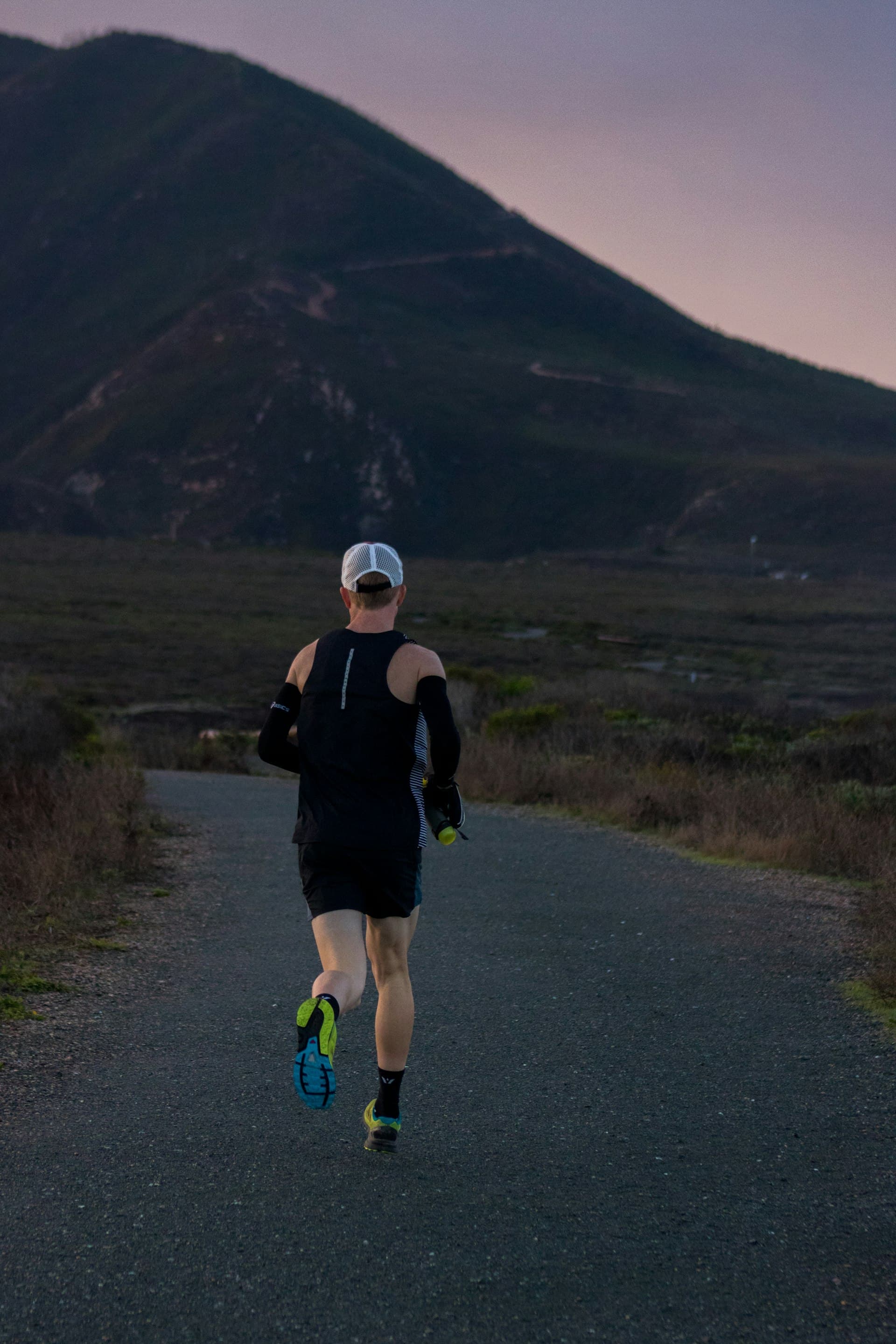 Woman jogging on a mountain road
