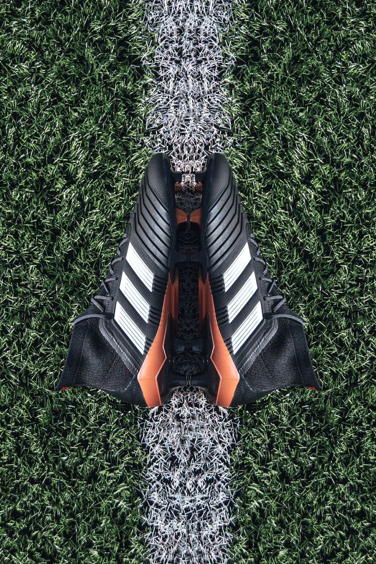 Football boots on grass field