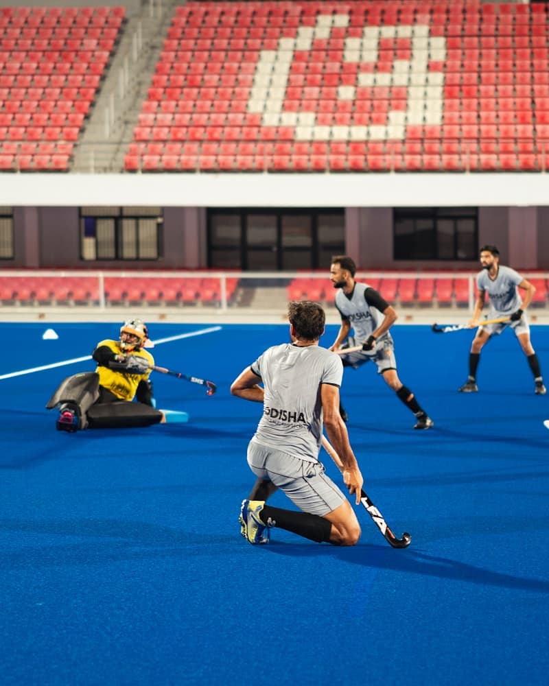 Field hockey players competing during a match
