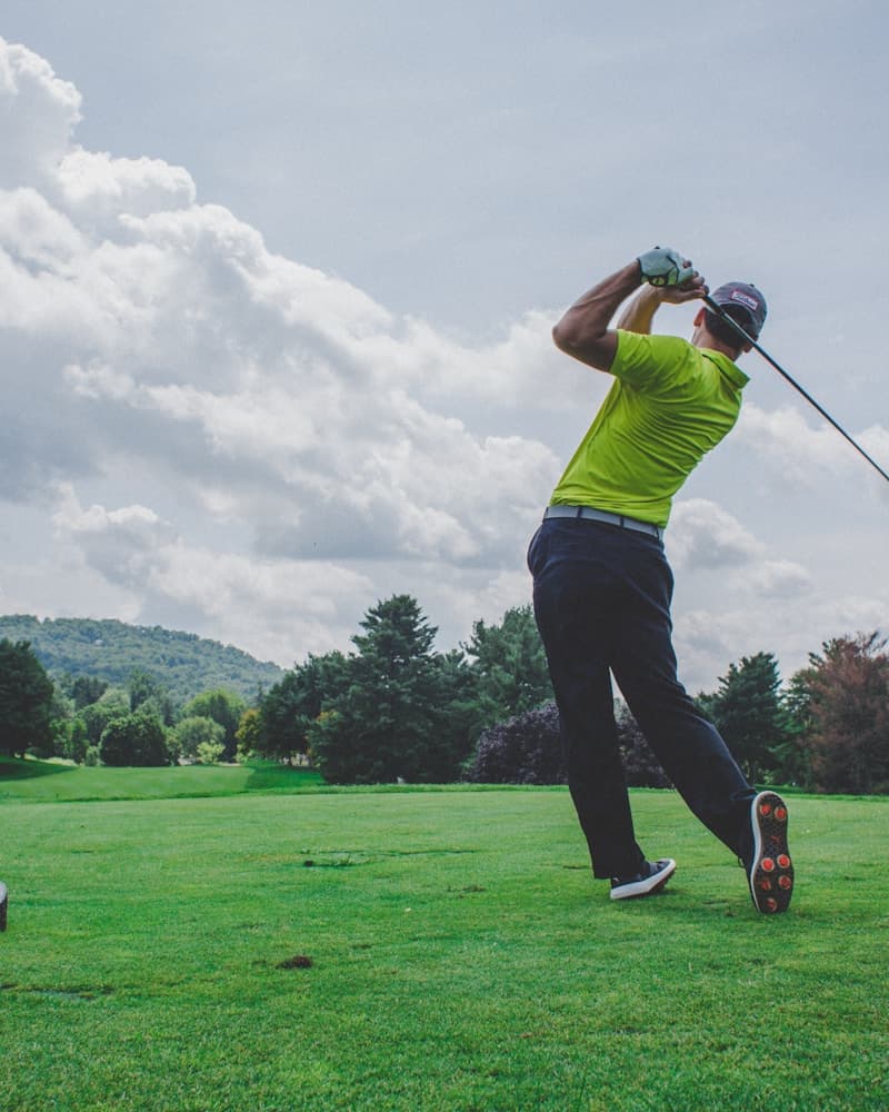 Golfer taking a shot on the course