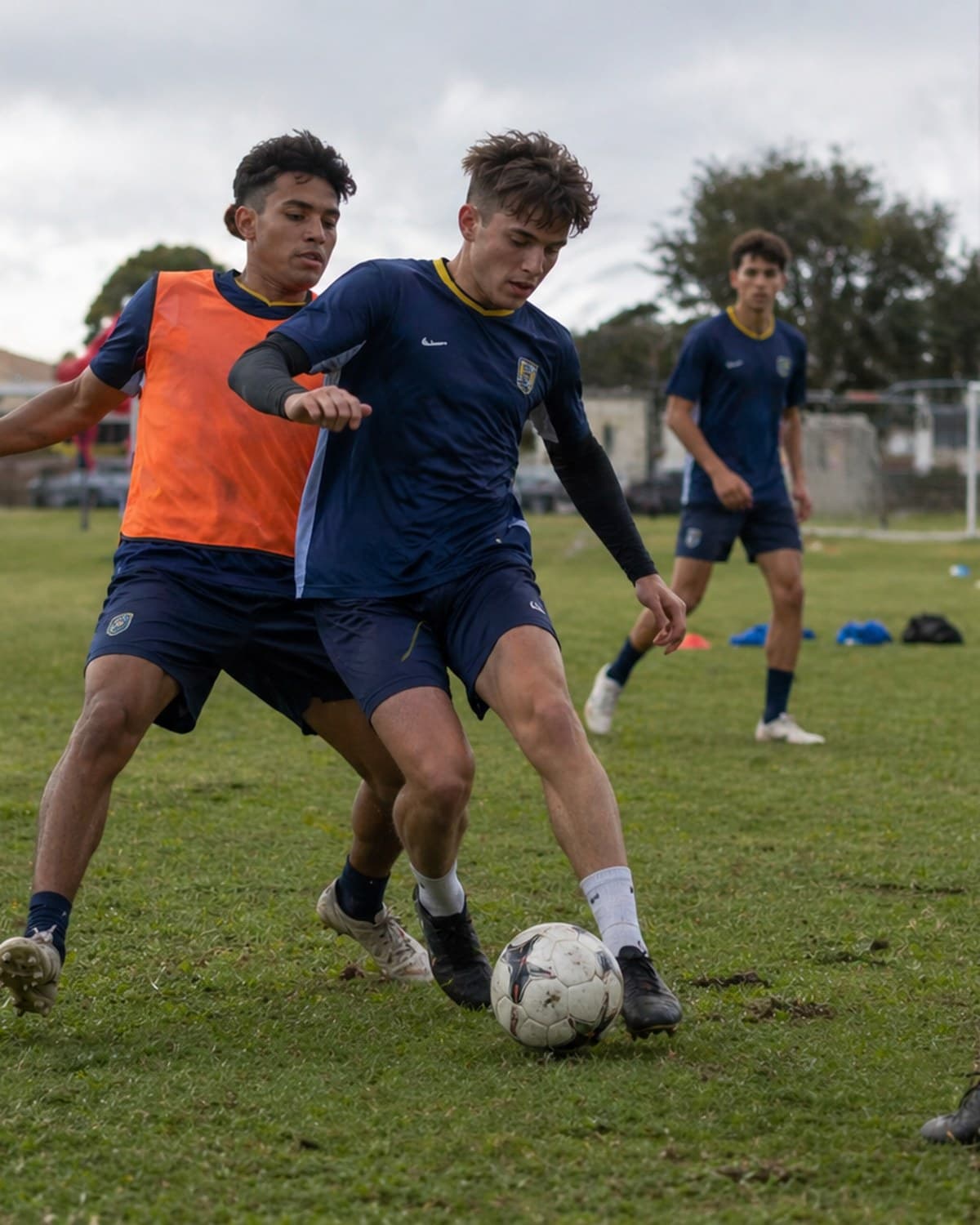 Soccer player dribbling the ball on the pitch