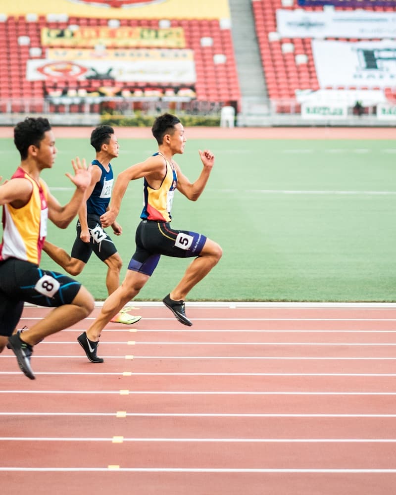 Sprinter in starting blocks on an athletics track