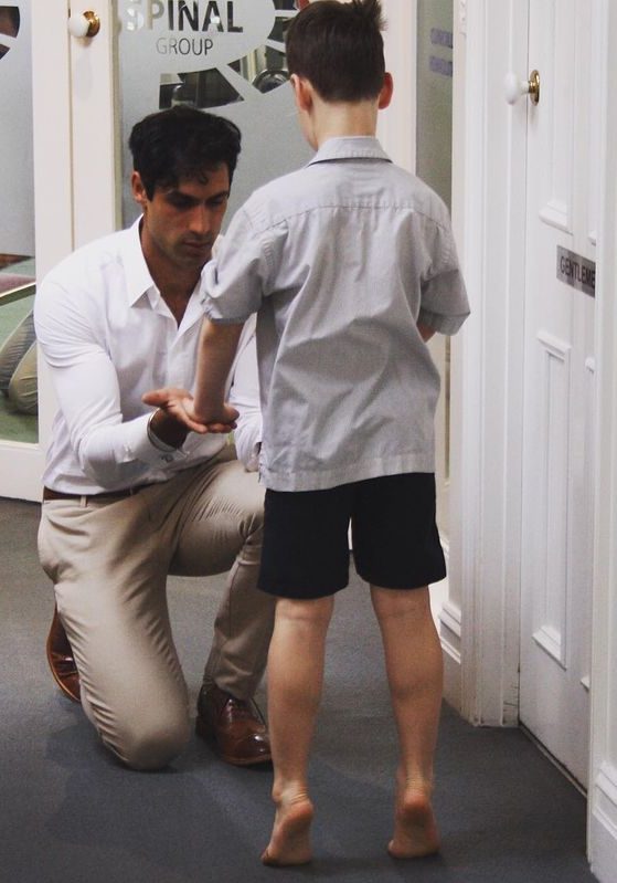 Dr Steven Singh treating a young patient as part of his Kids Podiatry speciality.